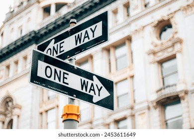 One way sign on the side of the street in Manhattan - New York City. - Powered by Shutterstock