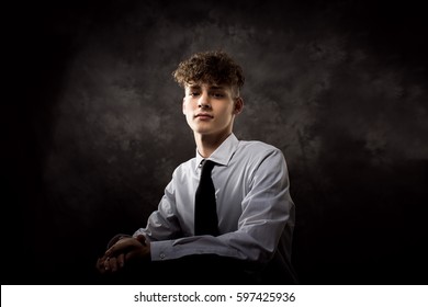 One Well Dressed Long Haired Male Model Teenager Posing For Yearbook Senior Picture