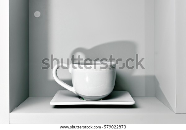 One White Cup Saucer On Shelf Stock Photo Edit Now 579022873