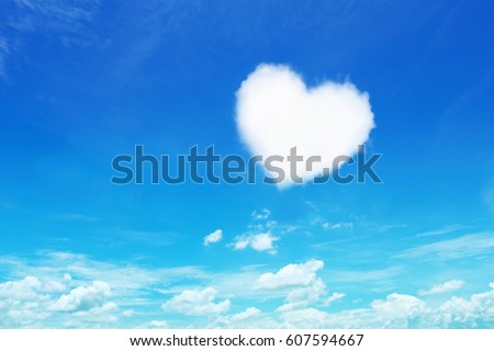 it is one white heart shaped cloud on blue sky.