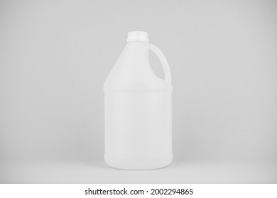 One White Plastic Gallon Jug Isolated On Gray Background.