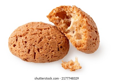 One whole and one broken amaretti biscuits isolated on white.