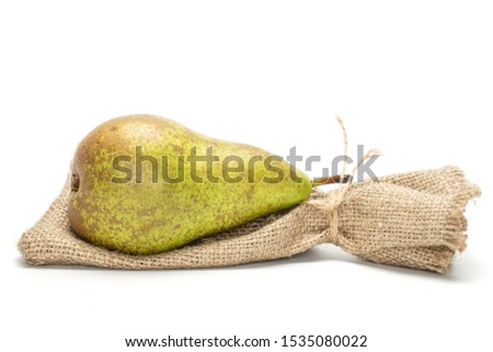 Similar – Image, Stock Photo one ripe green pear on a yellow background