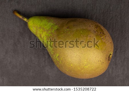 Image, Stock Photo one ripe green pear on a yellow background