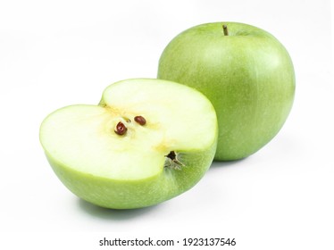 One whole and a half apple isolated on white background. Green fruit sliced