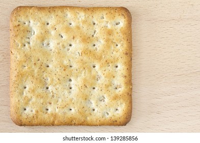 One Wholegrain Cracker On Wooden Board