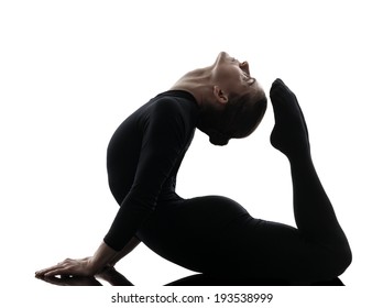 One  Woman Contortionist Practicing Gymnastic Yoga In Silhouette On White Background