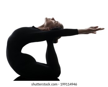 One  Woman Contortionist Practicing Gymnastic Yoga In Silhouette On White Background