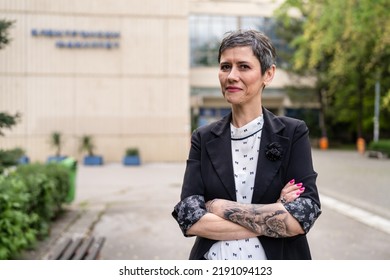 One Woman Mature Or Senior Caucasian Female Standing In Front Of The Building University Professor Or Company Manager In Day Waist Up Portrait Front View Copy Space Real People