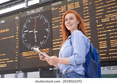 One Woman Portrait Waiting For Public Transport Timetable