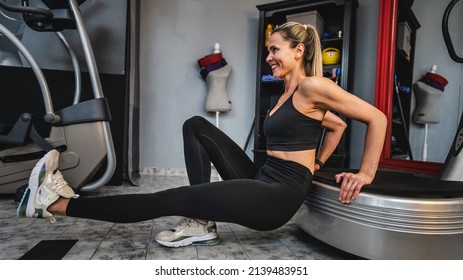 One woman training on the power plate machine female use powerplate for exercise