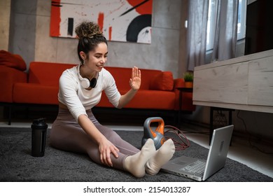 One Woman Young Adult Caucasian Female Sporty With Laptop Using Internet For Online Training At Home Real People Stretching Sport Health And Fitness Concept Copy Space