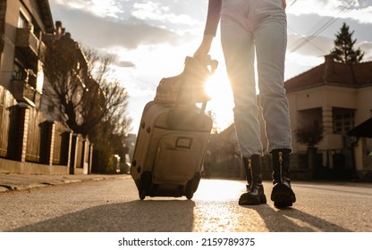 One Woman Young Adult Female With Suitcase Walking On The Street Moving To New House Tourist Lost In The Evening Searching For Apartment Or Hotel For Accommodation Leaving Town Real People Copy Space