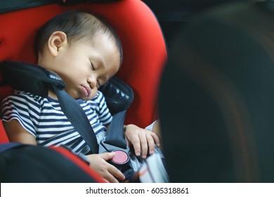 One Year Asian Baby Sleeping In Baby Car Seat