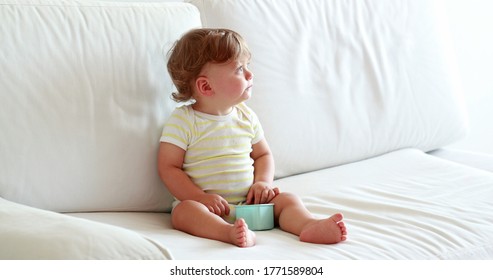 
One Year Old Baby Toddler Boy Sitting On Sofa Coughing, Sweet Adorable Infant Child