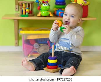 A One Year Old Child Playing In His Room