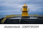 One of the yellow lighthouses at the shore of Reykjavik, Iceland