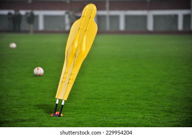 One Yellow Soccer Training Dummy On The Field