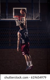 One Young Adult Man, Basketball Player, One Hand Slam Dunk, Indoors Dark, Rear View