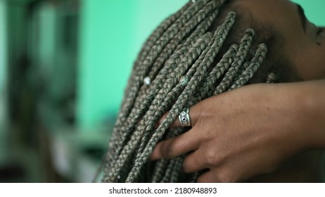 One Young Black Woman Playing With Braided Hair. An African American Girl Showing Her Dreadlocks Box Braid Hairstyle