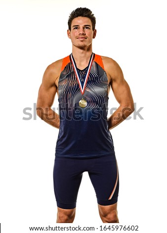 one young caucasian man athetle gold medalist athletics in studio isolated on white background