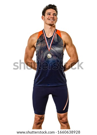 one young caucasian man athetle gold medalist athletics in studio isolated on white background