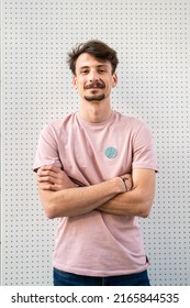 One Young Caucasian Man With Brown Hair And Mustaches Wearing T-shirt Looking To The Camera Modern Happy Adult Male Smile Confident Portrait In Front Of White Wall Copy Space Waist Up