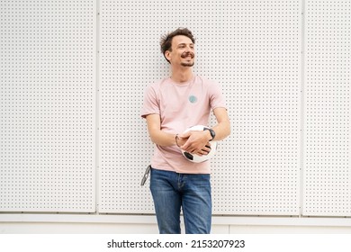 One young caucasian man modern adult male portrait waist up holding soccer ball in front of white wall football concept copy space - Shutterstock ID 2153207923
