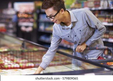 One Young Chinese Man Buying In The Market