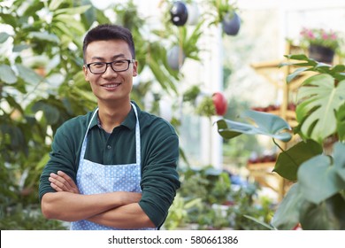 One Young Happy Asian Male Florist Working in Shop - Shutterstock ID 580661386