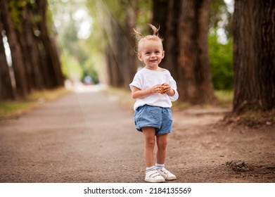 One Young Little Child Walking, Strolling Through A Green Field, Rural Forest Area Walk, School Age Girl Wandering Alone, Copy Space. Serene Outdoor Scene, Children Healthy Active Lifestyle Concept