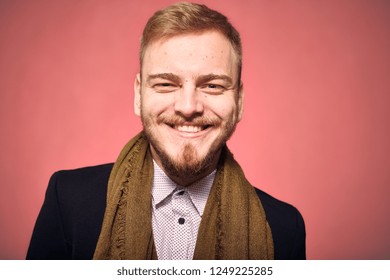 One Young Man, 20-29 Years Old, Looking To Camera, Candid Smiling Happy. Headshot, Close-up Of Head/face, Real Person, Not Model. Looking Friendly. Pink Background, Studio Shot, Photo Shoot.