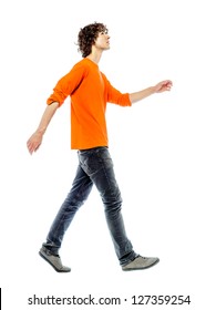 One Young Man Caucasian Walking Side View Looking Up  In Studio White Background