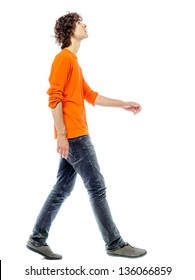 one young man caucasian walking side view looking up  in studio white background