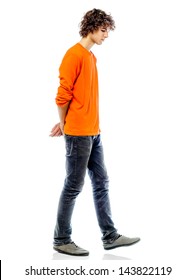 one young man caucasian walking sad bore side view   in studio white background