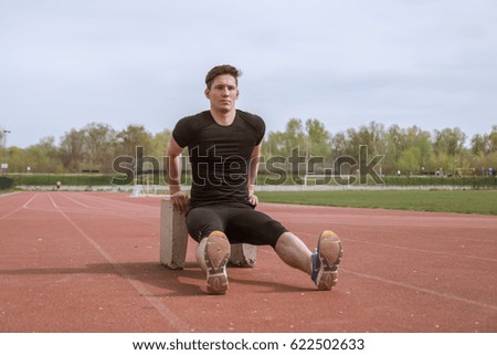 Similar – Image, Stock Photo athlete in black clothes clapping, white talc magnesium fly away
