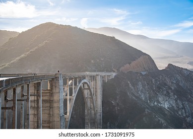 One Young Man Standing On Bixby Bridge, Highway 1, Monterey, CA, USA. Concept Of Solo Traveler, Solitude.