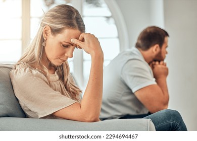 One young woman feeling frustrated and annoyed after an argument with her husband. A wife feeling distant after fighting due to marriage problems. A negative situation that could end up in divorce - Shutterstock ID 2294694467