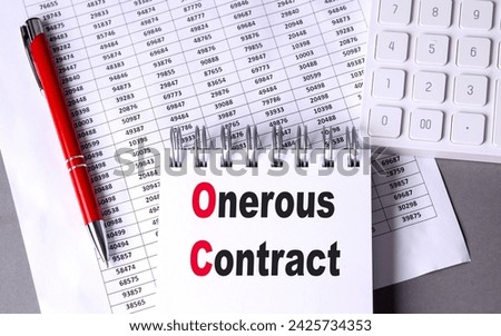 ONEROUS CONTRACT text on a notebook with pen, calculator and chart on grey background