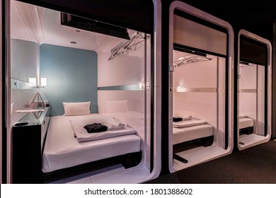 One-story bedroom area is combined inside a modern capsule hotel in Japan