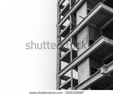 Ongoing construction of high building captured in black and white