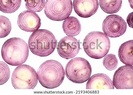 onion pieces placed in a bright background creats abstract texture 