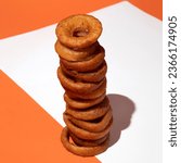 Onion ring tower on pattern backdrop