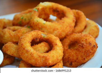 Onion rings on platter as appetizer and part of restaurant menu - Shutterstock ID 1686991213