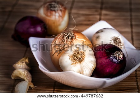Onions and garlic in bowl. Vegetables food. 