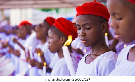 Onitsha, Anambra, Nigeria- May 30 2022: Group of school girls receiving the sacrament of Baptism and Confirmation