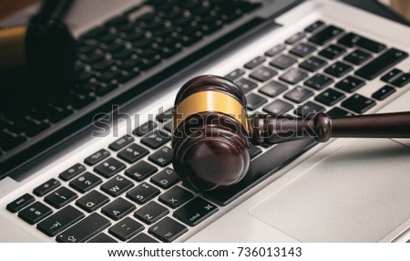 Online auction concept. Auction or judge gavel on a computer keyboard
