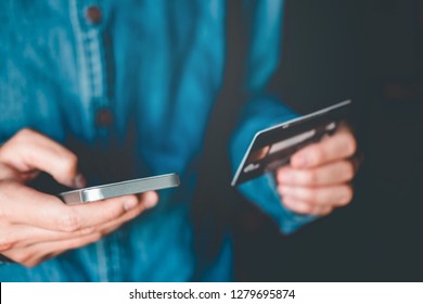 Online banking businessman using smartphone with credit card Fintech and Blockchain concept - Shutterstock ID 1279695874