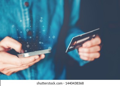 Online banking businessman using smartphone with credit card Fintech and Blockchain concept