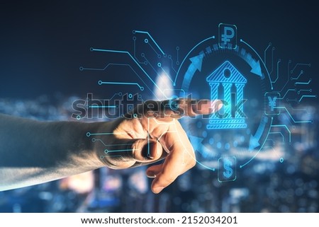 Online banking and digital money concept with man finger on virtual touch screen interface with central bank layout surrounded currency signs: dollar, euro, ruble and yen on abstract background